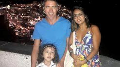 Family photo in Santorini by night. Lara is the world's youngest travel blogger.