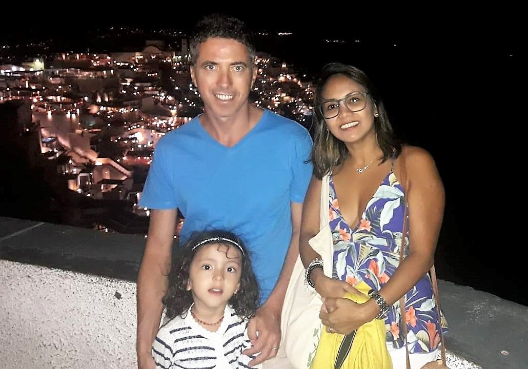 Family photo in Santorini by night. Lara is the world's youngest travel blogger.
