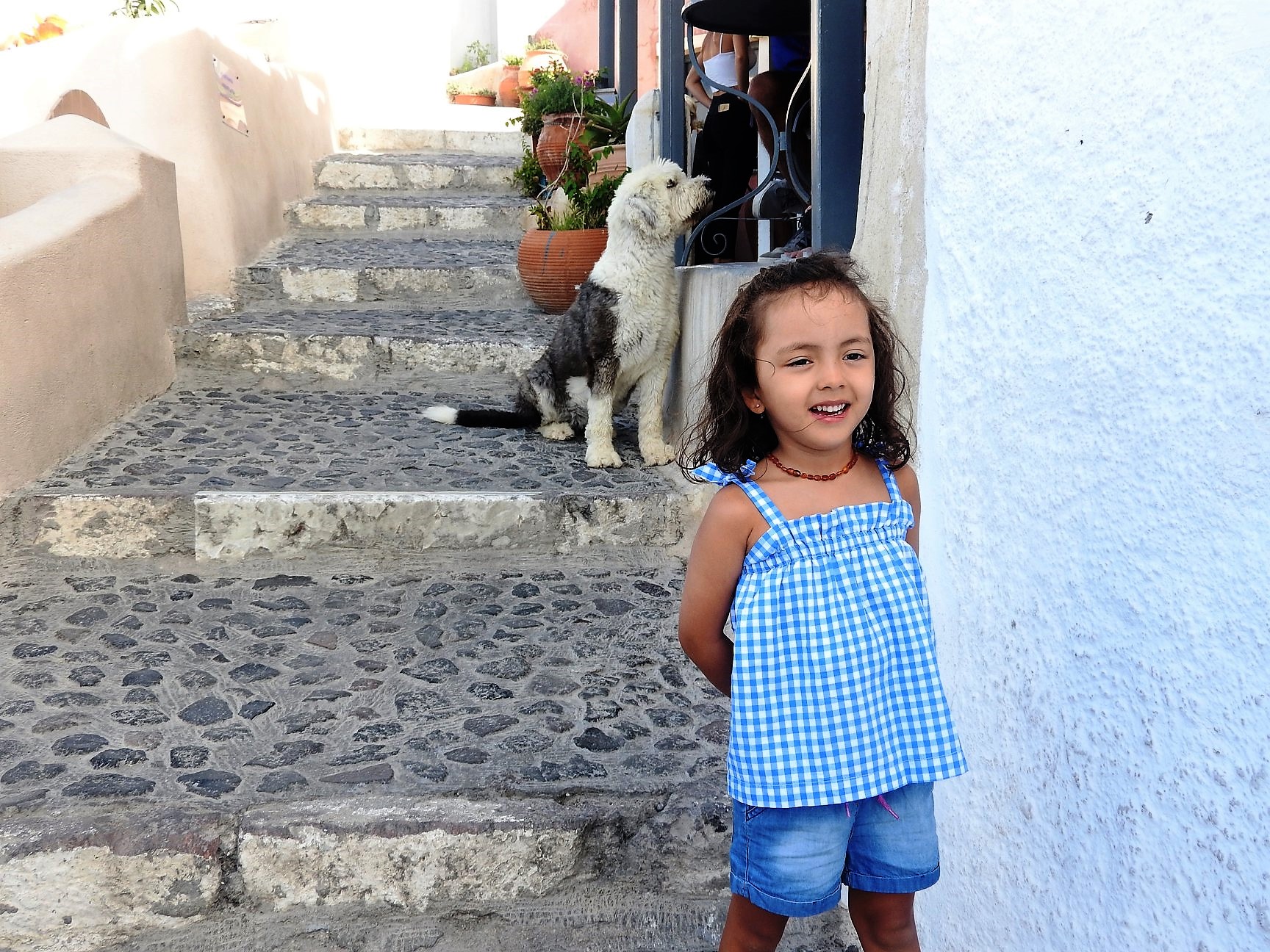 Lara in Oia, Santorini. Lara is the youngest travel blogger. in the world