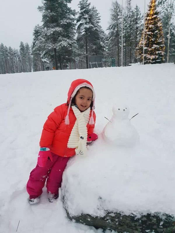 The world's youngest travel blogger and the snowman in Lapland Finland