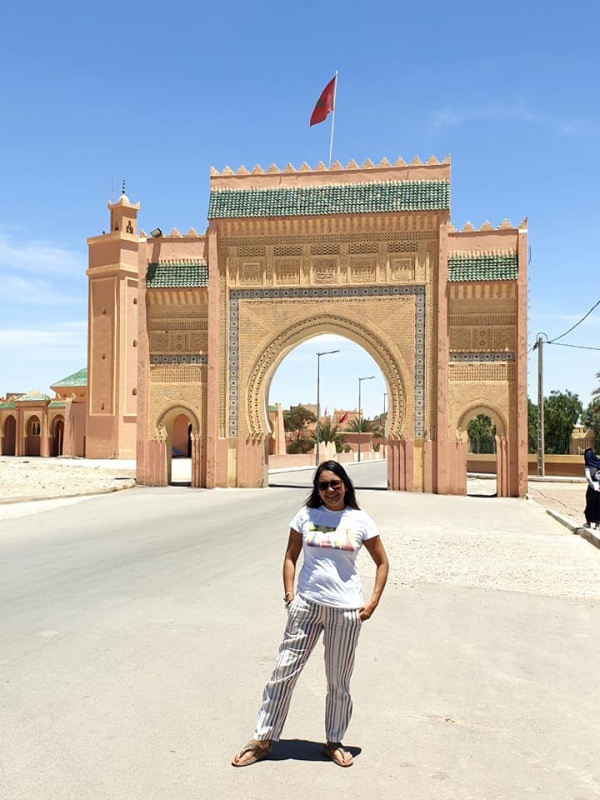 Mama Nerissa in front of the Door of the Sahara Desert in Rissani